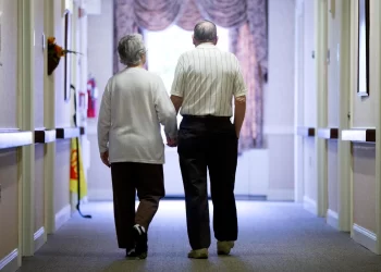 In this Nov. 6, 2015 file photo, an elderly couple walks down a hall of a nursing home in Easton, Pa.

Matt Rourke/AP Photo