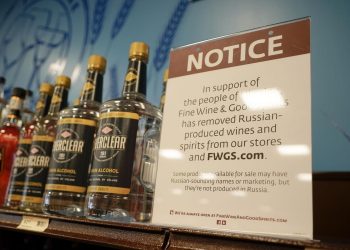 A sign in the vodka area of a Pennsylvania Fine Wine and Good Spirits store reflects the state's decision to withdraw Russian-made products for sale on Monday in Harmony, Pa.

Keith Srakocic | AP Photo