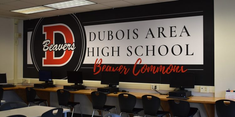 A new vinyl wall cling created at the North Central PA LaunchBox hangs in the Beaver Commons at DuBois Area High School.