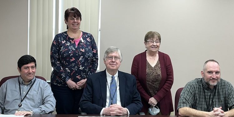 In the front, from left, are Commissioners Tony Scotto, John A. Sobel, board chairman, and Dave Glass. In the back are Julie Fenton, director of education outreach and community service, and Joan Bracco, marketing coordinator and ombudsman with CCAAA. (Photo by GANT News Editor Jessica Shirey)