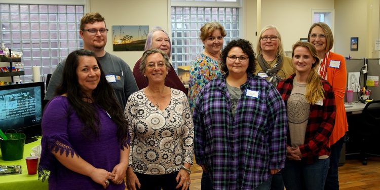 Pictured, from left, in front: Rhianna Speck of Side Door Soaps and Sundry Co., Sue Morris of Sue's Salves, Lisa Conklin Conn of Conklin Studio Pottery, and Rachel Courtney of Sugar Mama's Appalachian Maple; and in back: Joshua Smith of Valley Glass Art, Karen Heltzel of Moments in Time Studio, Niccole St. Laurent of St. Laurent Pottery, Stephanie Distler of Stephanie Distler Artisan Jewelry, and Julie Mader of Artwork by Julie Mader.