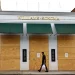 A man walks April 29, 2020, in the Shadyside shopping district of Pittsburgh past a temporarily boarded up Williams-Sonoma store.

Gene J. Puskar / AP photo