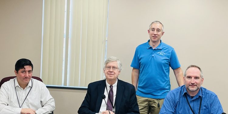 Pictured, in front from left to right, are: Commissioners Tony Scotto, John A. Sobel, board chairman, and Dave Glass. In the back is Jeremy Ruffner, 911 coordinator. (Photo by GANT News Editor Jessica Shirey)