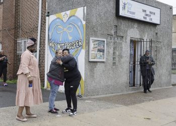 Penny Martin (left) and the Rev. Michelle Simmons, founder and executive director of Why Not Prosper, hug outside of a recovery home in Philadelphia. Simmons said the new licensing system will "make owners … step up their game."

ELIZABETH ROBERTSON / Philadelphia Inquirer