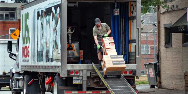 A food truck driver wheels a cart full of products for delivery to an establishment June 5, 2020, in Pittsburgh's Southside.

Keith Srakocic / AP photo