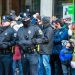 Two Philadelphia Police officers stand in front of crowd of spectators on Broad Street during the New Years Day Mummers Parade on Jan. 1, 2020. Hiring of officers, and retention of them, was the focal point of a hearing Monday.

Alan Budman / Shutterstock