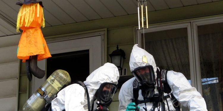 Members of the Pennsylvania State Police Clandestine Lab Response Team remove chemicals from the front porch of a home in Minersville in 2013.

Frank Andruscavage/Republican-Herald