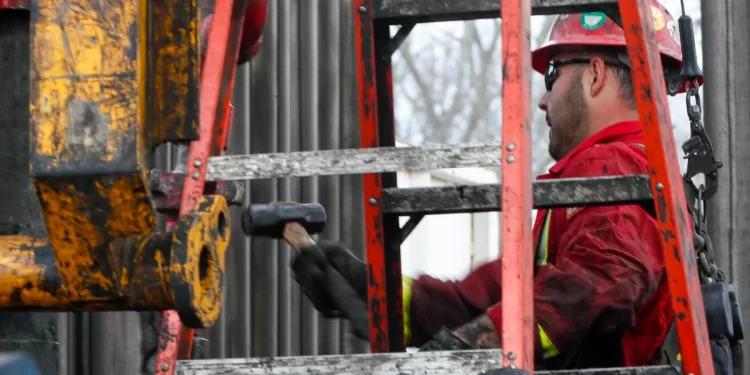 Workers change the equipment on the drilling platform March 12, 2020, at a Seneca Resources shale gas well drilling site in St. Mary's, Pa.

Keith Srakocic / AP Photo