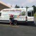 The Clearfield County Public Library’s new Mobile Services Outreach Coordinator, Chase Skrzypek, poses outside the Mobile Service Unit. Chase took over the position in April and is enjoying learning about the patrons scattered throughout the county. (Photo by Julie Rae Rickard)