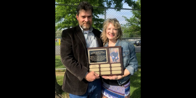 Gordon and Valerie Beers are pictured with the plaque that will be on display at the Clearfield County Career and Technology Center listing the recipients of the Scott Beers Memorial Scholarship.   In May, the names of the 2022 recipients, Erik Conaway, Abigail Depto, Alex Leskovansky and Adriyanna Dale were added to the plaque.