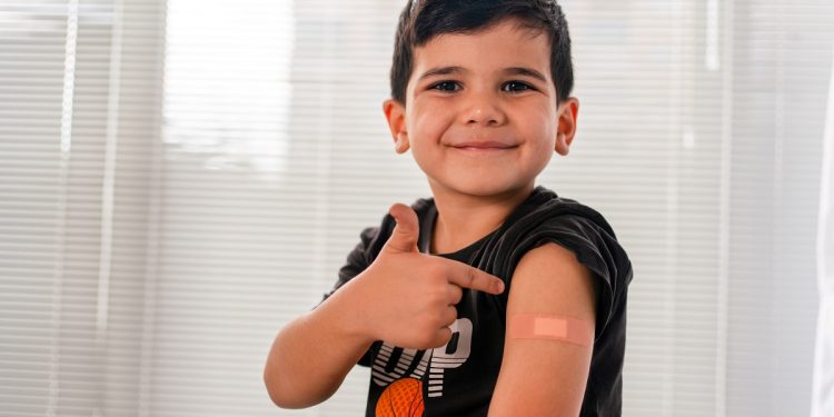 Vaccinated child Showing Shoulder After Shot