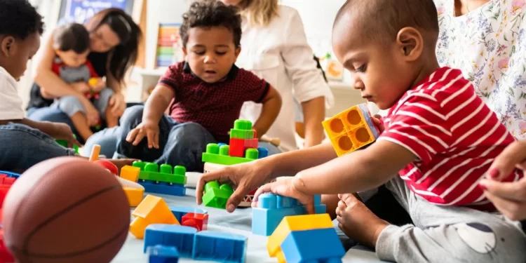 Children at day care playing with toys. 

Rawpixel.com / Shutterstock