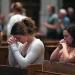 University of Pittsburgh student Olivia Meholic, front, prays after receiving Communion at St. Paul Catholic Cathedral in Pittsburgh on June 26. During the service, the Very Rev. Kris Stubna gave a homily focused on the Supreme Court's decision to overturn the nearly 50-year-old Roe v. Wade ruling, which he said was the result of prayers and efforts of many Catholics and others.

Jessie Wardarski / AP Photo