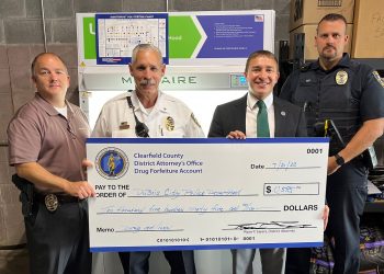 In the picture, from left to right, are:  Cpl. Matthew Robertson, DuBois Police Chief Blaine Clark, District Attorney Ryan Sayers and Assistant Chief Dustin Roy.