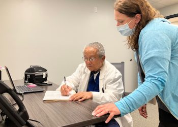 Dr. Baltazar Corcino and Registered Nurse Laura Nearhood review a patient chart at the Susquehanna Wellness Clinic in Clearfield.