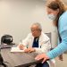 Dr. Baltazar Corcino and Registered Nurse Laura Nearhood review a patient chart at the Susquehanna Wellness Clinic in Clearfield.