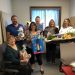 Members of the 2022 Ann S. Thacik Charity Auction with some auction items that have already been donated.  Left to right are Joan Bracco, Steve Harmic, Ronda Vaughn, Matt Day, Vicki Myers and Cathie Hugar.