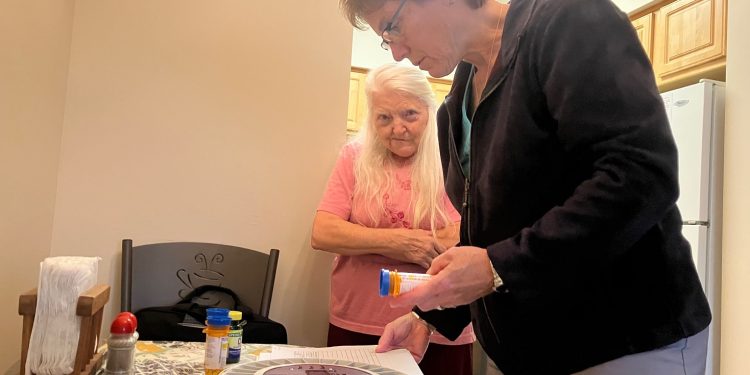 Licensed Pharmacist Brenda Weber fills an alarmed med box that helps client Lois Davis manage her prescriptions. This service is offered through the Susquehanna Wellness Clinic, an affiliate of the Clearfield County Area Agency on Aging (CCAAA).