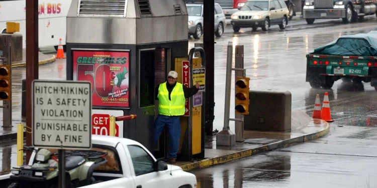 A toll worker gives a motorist a thumbs-up after waving their vehicle past a ticket booth in Carlisle, Pa. 

Carolyn Kaster / AP Photo