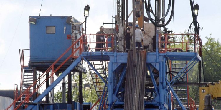 A crew works on a gas drilling rig at a well site for shale-based natural gas in Zelienople, Pa.

Keith Srakocic / AP file photo