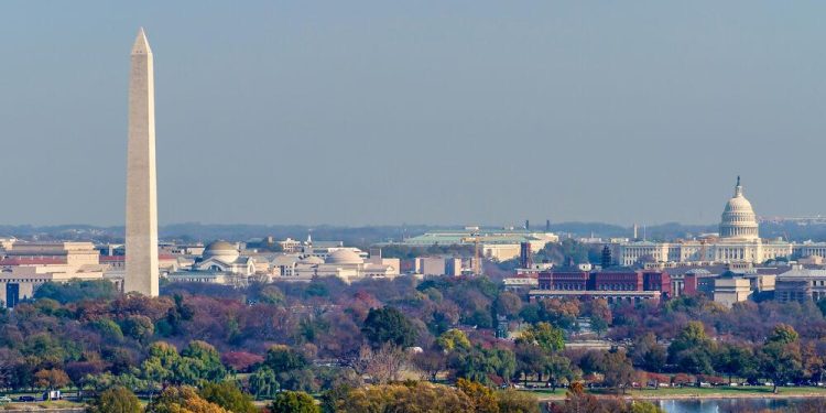 The Washington Monument and United States Capitol Building stand tall amongst the fall landscape of Washington D.C.

Shutterstock