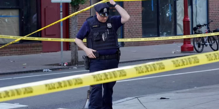 Philadelphia Police investigators work the scene of a fatal overnight shooting on South Street in Philadelphia, Sunday, June 5, 2022. 

AP Photo/Michael Perez