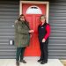 Donna Shaw, left, receives the keys to her new home at Village of Hope from Mature Resources CCAAA CEO Kathleen Gillespie. Shaw is the first person to officially become a resident at the VOH following the recent completion of the first homes at the site.