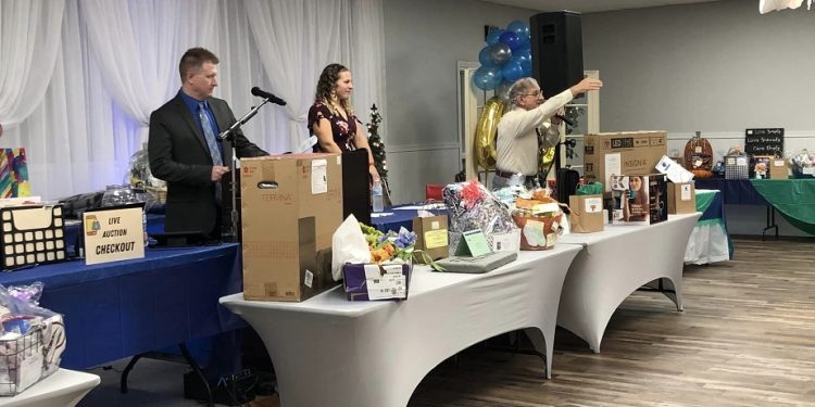 Left to right, Emcee Matt Day, as well as Auctioneers Stephanie Tarbay and Pat Errigo, kept the crowd entertained at the 27th Annual Ann S. Thacik Charity Auction.