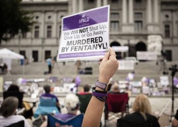 People gather on the steps of the Pennsylvania State Capitol in Harrisburg to honor lives lost to addiction during 2021's Overdose Awareness & Memorial Day.

Amanda Berg / For Spotlight PA