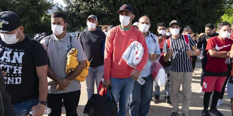 Migrants hold Red Cross blankets after arriving at Union Station near the U.S. Capitol from Texas on buses on April 27, 2022, in Washington.

Jose Luis Magana | AP