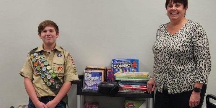 Danny Redding, 15, of Curwensville recently donated an activity cart that he completed as his Eagle Scout project to the Adult Day Center in Clearfield. Center Coordinator Julie Fenton, right, accepted the gift, which will provide stimulating activities for seniors who spend time at the center.