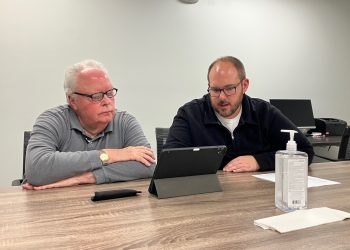 Dr. Richard Johnson, left, and Mature Resources Chief Operating Officer Ethen Tarner set up access for the doctor’s accounts at Susquehanna Wellness Clinic. Johnson will begin to see patients at the clinic in December.