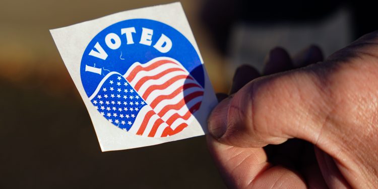 A voter holds an “I Voted” sticker on Election Day 2022 in Pennsylvania.

Matt Smith / For Spotlight PA