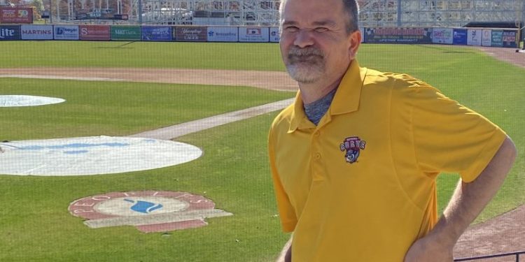 Long time staff member Tom Crownover poses at the stadium he loves, eagerly awaiting the start of Altoona Curve baseball next Spring.