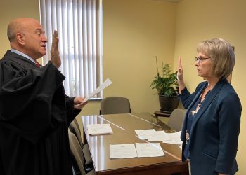 Judge Paul Cherry swears in Mature Resources CCAAA CEO Kathleen Gillespie to her position as a member of the Pennsylvania Long-Term Care Council.