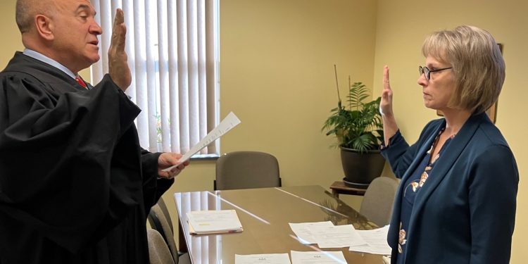 Judge Paul Cherry swears in Mature Resources CCAAA CEO Kathleen Gillespie to her position as a member of the Pennsylvania Long-Term Care Council.