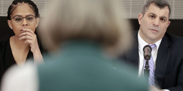 Pennsylvania lawmakers Morgan Cephas (left) and Mark Rozzi (right) listen to a speaker in Philadelphia.

ELIZABETH ROBERTSON / Philadelphia Inquirer