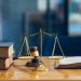 Symbols from the criminal justice system; a scale, a gavel and legal textbooks

Credit: Adobe Stock