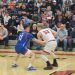 Cole Miller (33) tries to find a lane to pass the ball as Blaise Krizner (11) plays tight defense.  Miller finished with 13 points in the loss to the Mustangs.