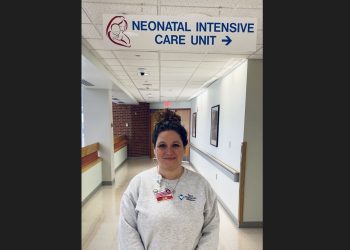 Shannon Gill, RN, SUD/OUD Pregnancy Postpartum Care Coordinator is standing outside of the NICU at Penn Highlands DuBois.