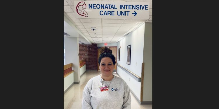 Shannon Gill, RN, SUD/OUD Pregnancy Postpartum Care Coordinator is standing outside of the NICU at Penn Highlands DuBois.