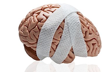 Gauze wrapped around a brain to symbolize a brain injury.