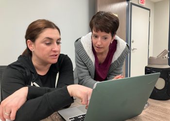 Dr. Jessica Ayres, left, seated, reviews patient charts with Practice Manager Megan Patrick between appointments at the Susquehanna Wellness Clinic. Ayres is now accepting new patients who may be seen at the clinic, or during in-home visits. (Provided photo)