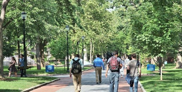 Students walk at Penn State (Shutterstock).