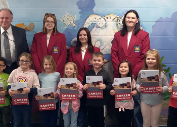 Pictured is the delivery to Clearfield Area Elementary School students. In the back, from left, are: elementary Principal Kenneth Veihdeffer and Digital Media Arts students Addison Yatchik, West Branch; Kristie Sharpless, Philipsburg-Osceola; and Katie Thomas, Clearfield.
