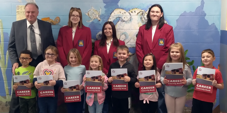 Pictured is the delivery to Clearfield Area Elementary School students. In the back, from left, are: elementary Principal Kenneth Veihdeffer and Digital Media Arts students Addison Yatchik, West Branch; Kristie Sharpless, Philipsburg-Osceola; and Katie Thomas, Clearfield.