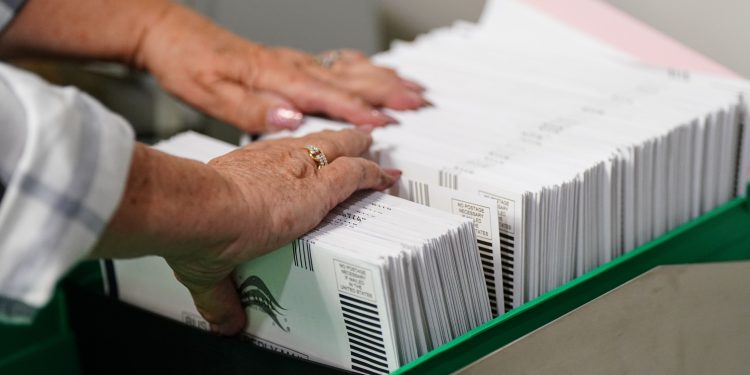 Mail-in ballots are sorted in Allentown, Pa. in 2022. A new bill would give counties more time to prep these ballots.

Matt Smith / For Spotlight PA