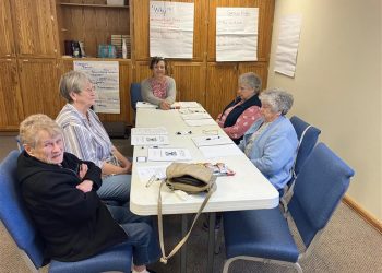 Health and Wellness Coordinator Bobbie Johnson, at center, leads a group of Health and Wellness program participants in an introduction to the Matter of Balance program.  At left, front to back, are Mary Kay Yarger and Janet Bietz. At right, front to back, are Phyllis Bauman and Nancy Lanich.
