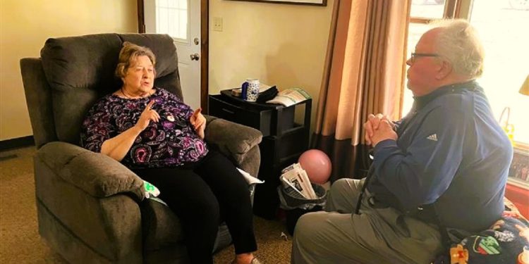 Patient Doris Carns visits with Dr. Richard Johnson during a wellness exam in her home. Dr. Johnson and other medical professionals at the Susquehanna Wellness Clinic are available for in-home visits for the convenience and safety of their patients.