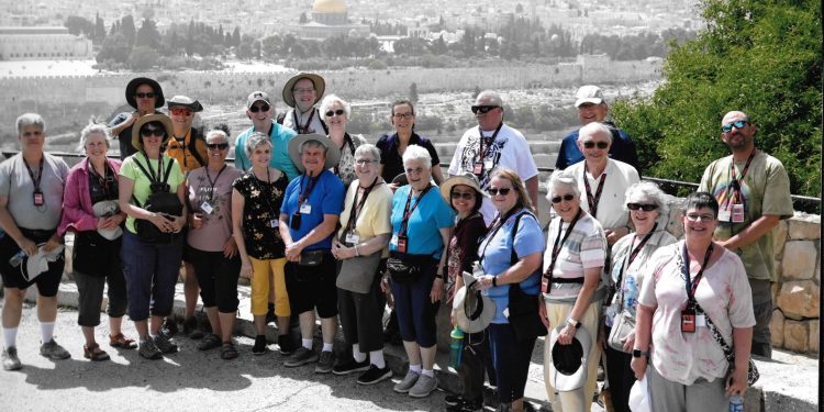 The pilgrims from Christ Lutheran Church, DuBois, are shown on the Mount of Olives overlooking the Old City of Jerusalem on a hazy day. The Dome of the Rock is prominent in the background as is the eastern wall of the Old City of Jerusalem. Front from left:  Mahmet Gurgen, Nora Nealon, Susan Hauser, Wendy Wells, Linda London, Gary Bogle, Debbie Gillung, Jerry Watson, Lily Brubaker, Debbie Brubaker, Ginny Schott, Jan Deitman, and Joann Krukow. Back from left:  Jim Nealon, Ernie Hauser, Darwin London, Chris Luckenbill, Donna Bush, Pastor Amy Godshall-Miller, Joe Krukow, Pastor John Miller, Tom Schott, and tour guide Matt Churchill.